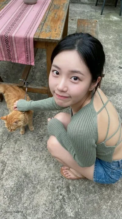 Ivy relaxing at home with her cat